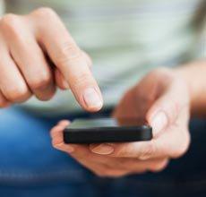 A person operating a touch phone